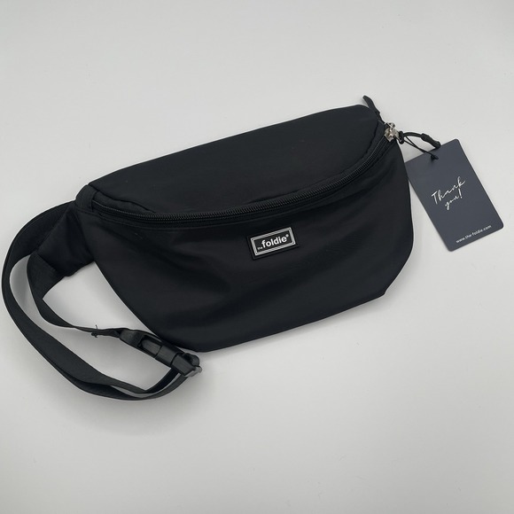 NWT The Foldie Crossbody Purse Fannypack Black Nylon Crossbody Travel RFID Light - Picture 1 of 8